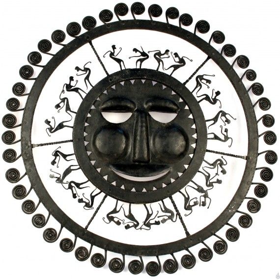 Wrought iron sun with dancing tribals